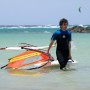 Learning windsurfing in the shallow waters on Cotillo lagoon